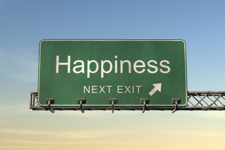 A road sign "Happiness Next Exit"